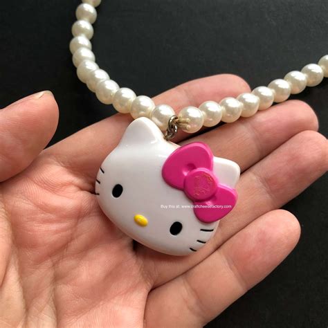 x hello kitty blue pendant.